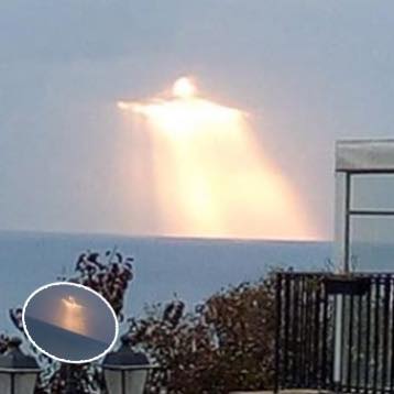 As the light breaks through clouds over Italy, a breathtaking image of “Jesus” appears in the sky.