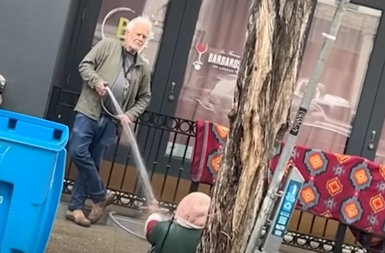 Man Sprays Homeless Lady in San Francisco with Hose to Get Her to Move