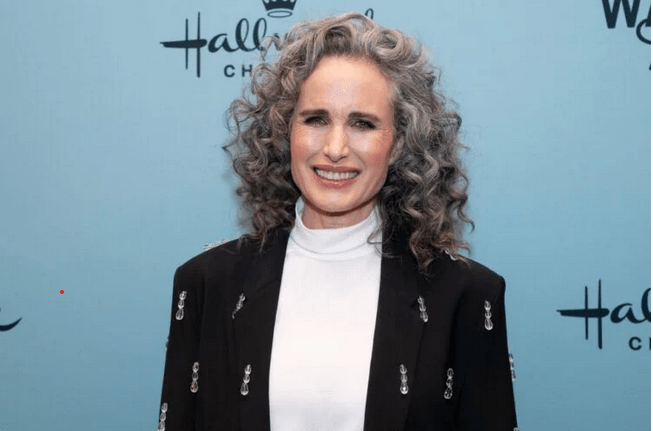 Andie MacDowell reacts to claims that her gray hair makes her appear older.