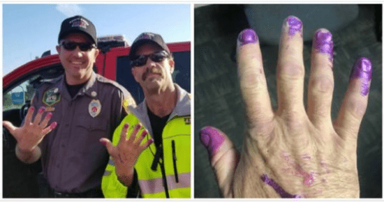 Firefighters encourage a young girl at the crash site to paint their nails in order to reassure her.