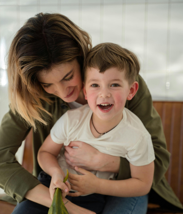 A mother and son playing together